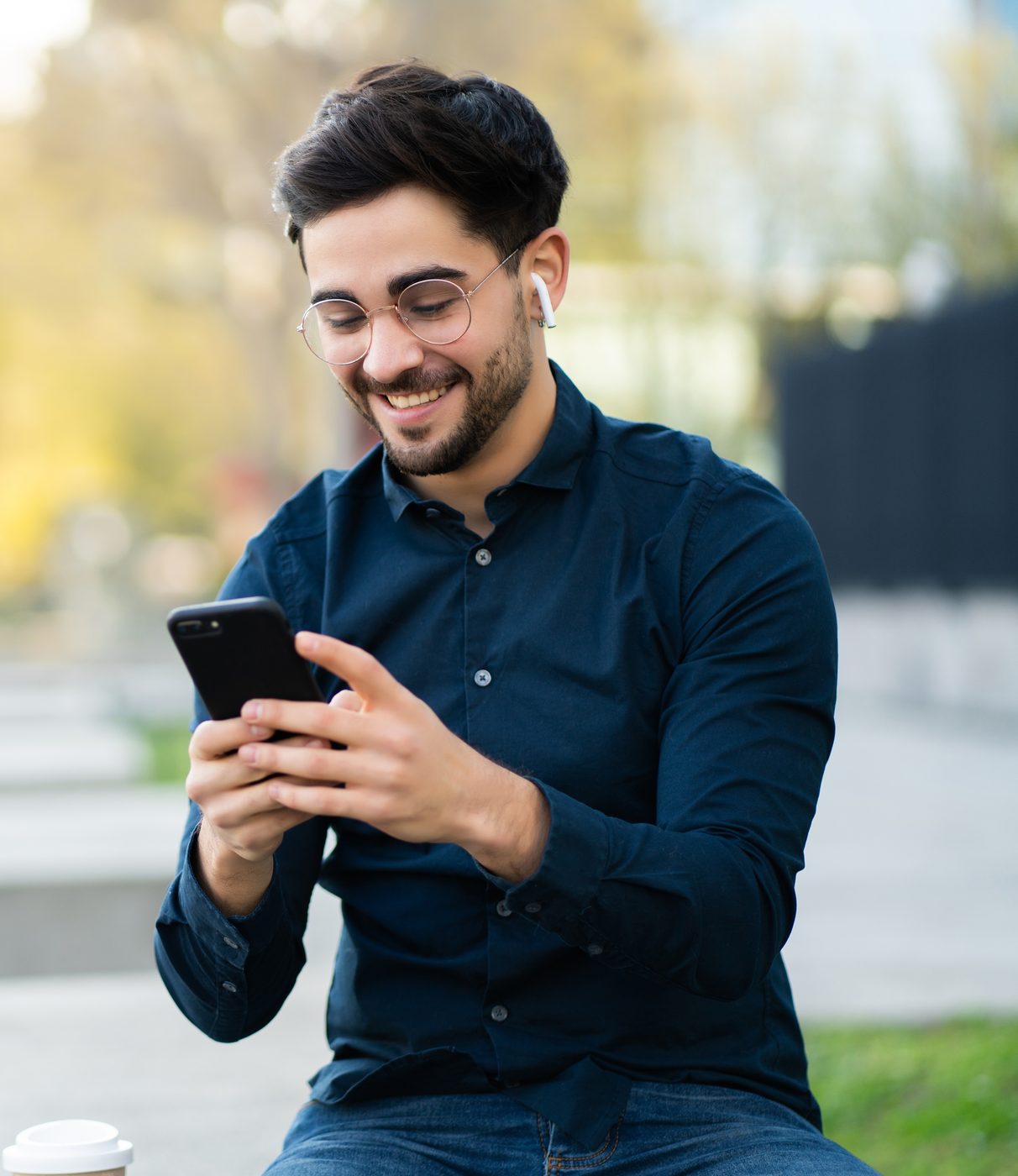 Business professional using WhatsApp on a mobile phone